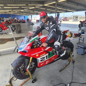 Dr. Shaikh on a motorcycle